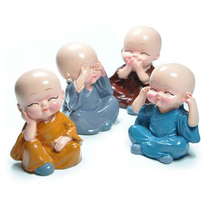 Baby Buddha showpiece set featuring four colorful smiling figurines in joyful poses