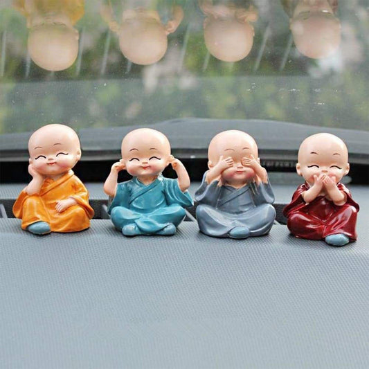 Baby Buddha showpiece set featuring four colorful laughing figures for home decoration