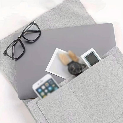 Gray bedside pocket organizer for essentials holding phone glasses and small items from THE GIR FARMER