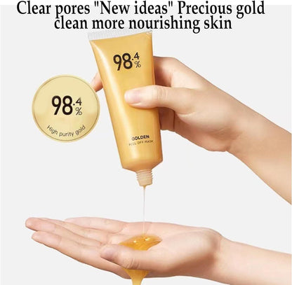 Gold face mask for glowing skin in a tube being applied for nourishing skincare benefits