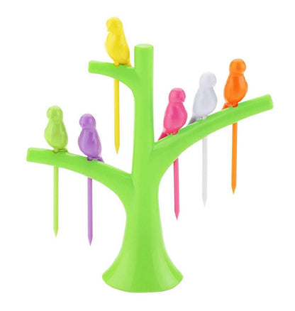Colorful bird fruit forks for kids displayed on a green tree stand, perfect for fun snacks