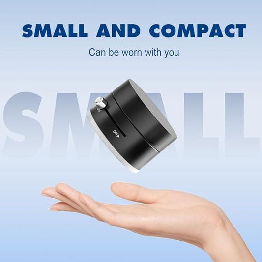 Small and compact magnetic car dashboard phone holder held above an open palm against a blue background