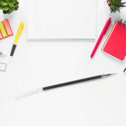 Black pen refill for smooth writing, surrounded by office essentials like notepads and highlighters