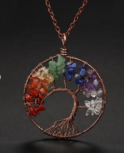 Bohemian tree of life necklace featuring multicolored crystals on a copper wire pendant