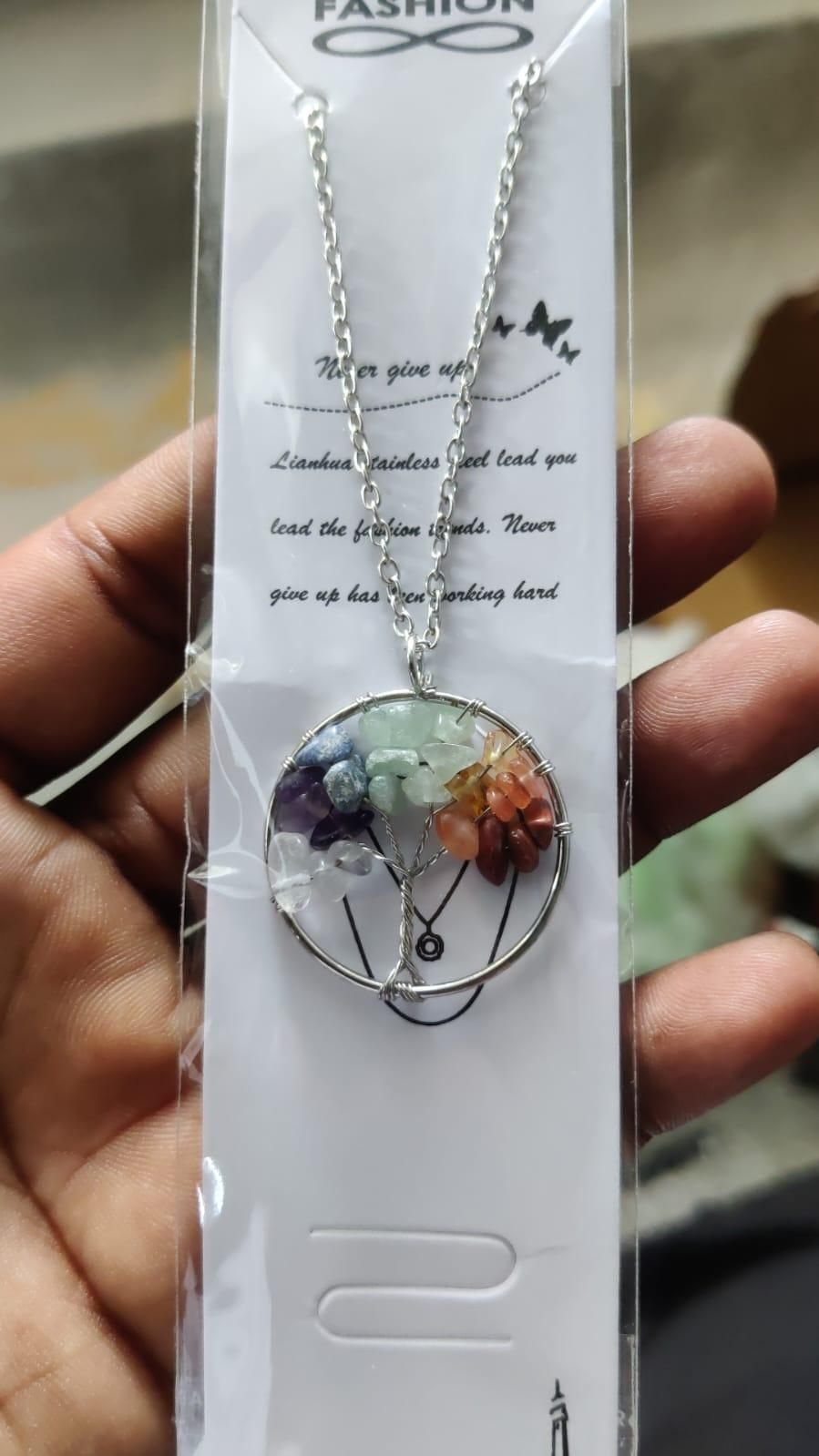 Bohemian tree of life necklace with colorful gemstones in a silver circular pendant