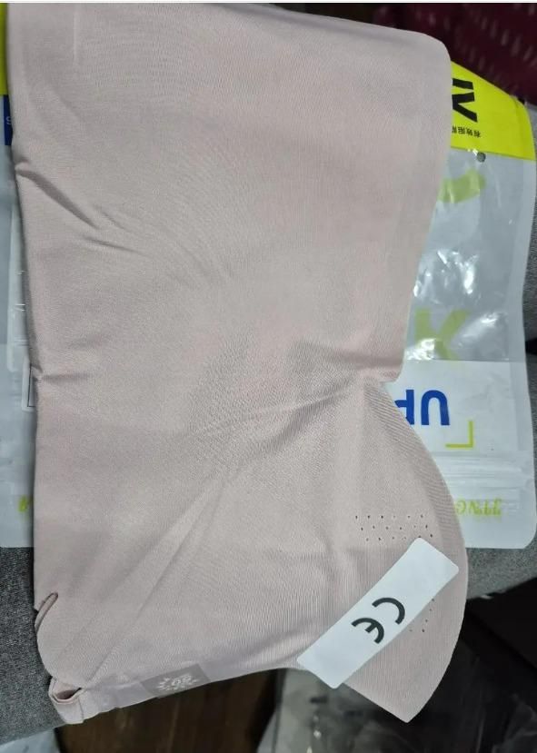 Light pink breathable neck length mouth mask designed for comfortable daily use