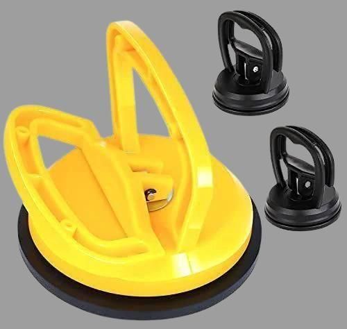 Yellow car dent puller tool set with two black suction cups for effective dent removal