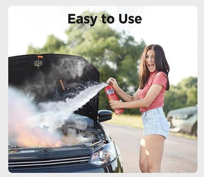 Woman using car fire extinguisher spray on a burning car for quick and effective fire safety