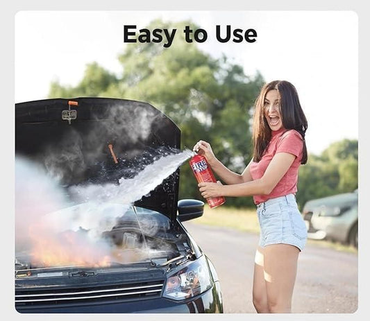Woman using car fire extinguisher spray on a burning car for quick and effective fire safety