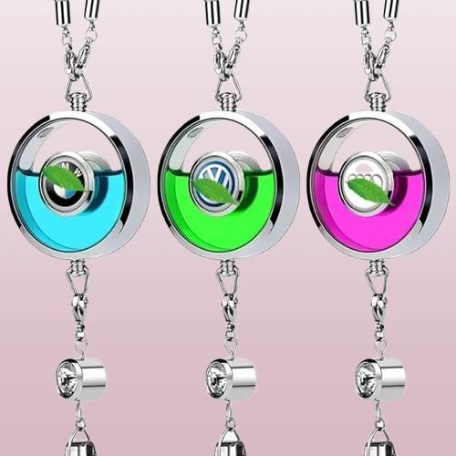Three colorful car logo perfume pendants with unique logo designs and vibrant liquid colors