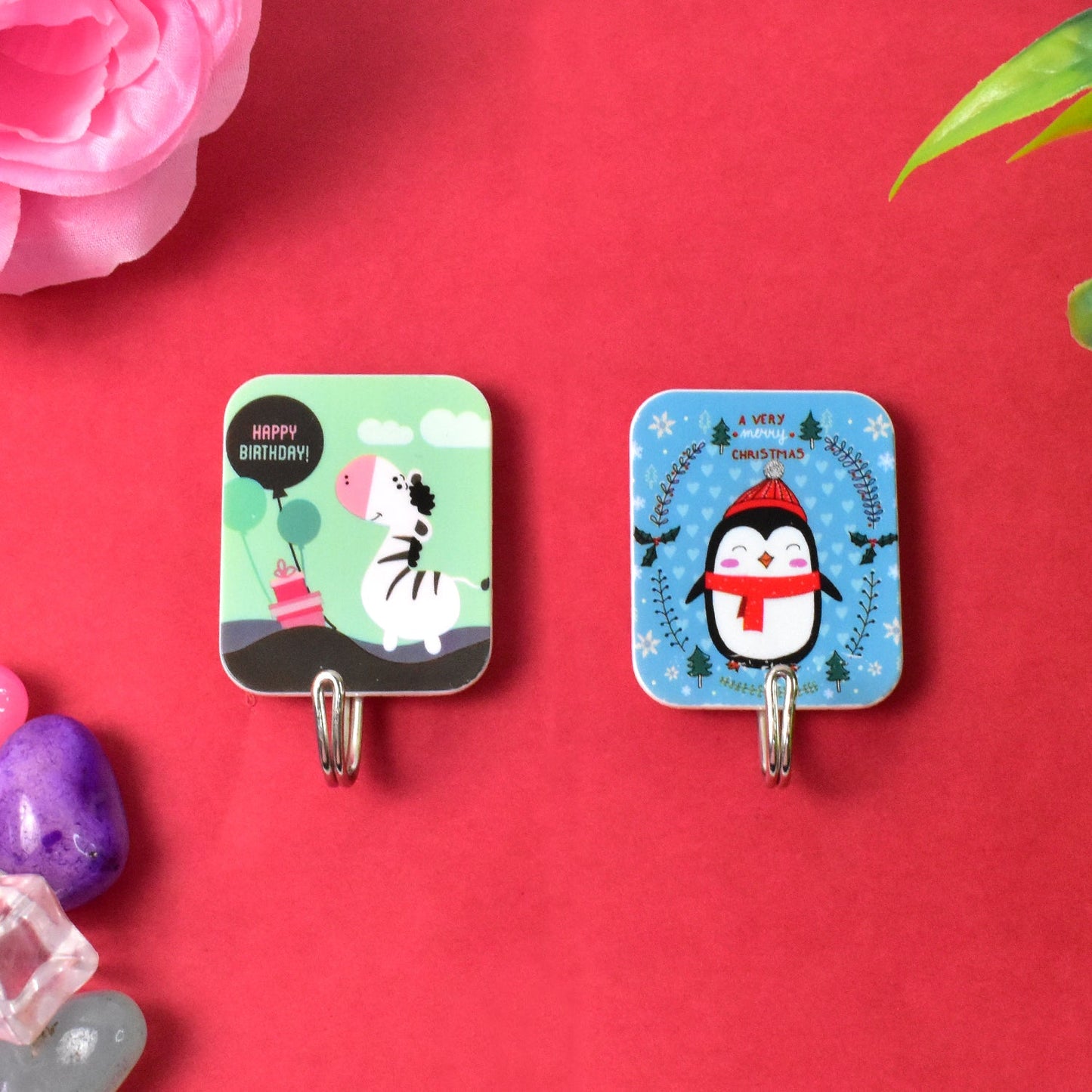 Cartoon self-adhesive hooks featuring a zebra and a penguin design for fun home organization
