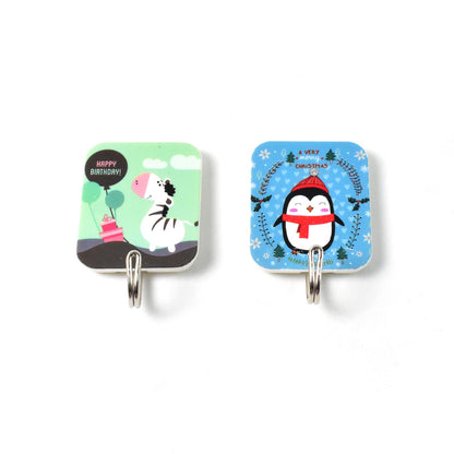 Colorful cartoon self-adhesive hooks featuring a zebra and a penguin design for playful home organization