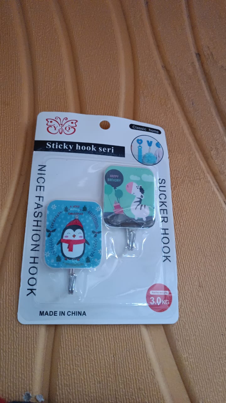 Cartoon self-adhesive hooks featuring a penguin and cat design for home organization