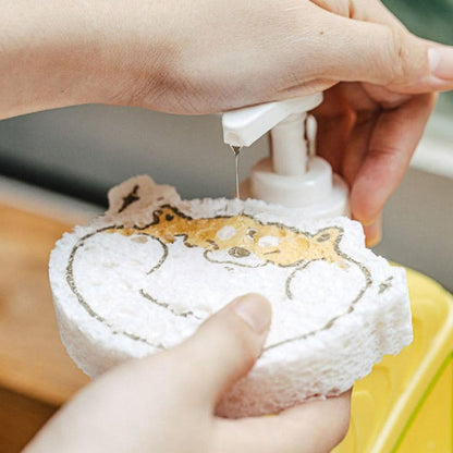 Using a cartoon wood pulp dish sponge for cleaning dishes with soap dispenser