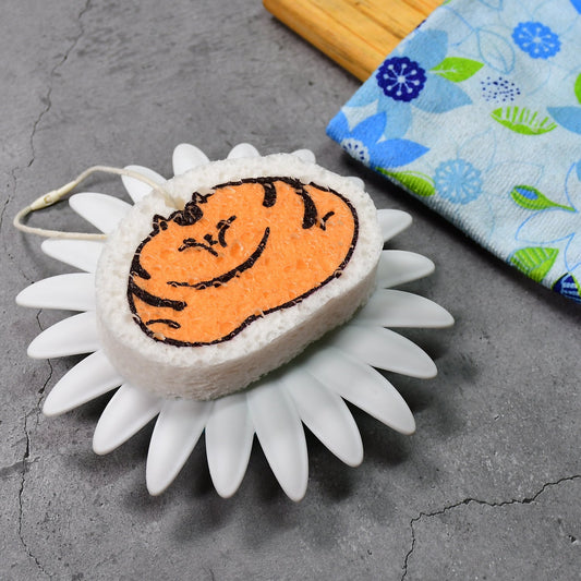 Cartoon wood pulp dish sponge shaped like a cat on a flower-shaped holder for fun cleaning