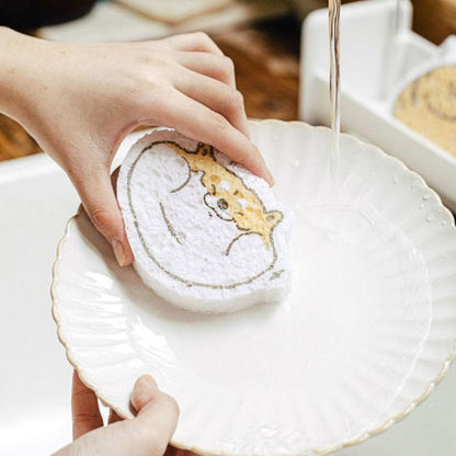 Cartoon wood pulp dish sponge being rinsed in a sink, perfect for cleaning dishes effortlessly