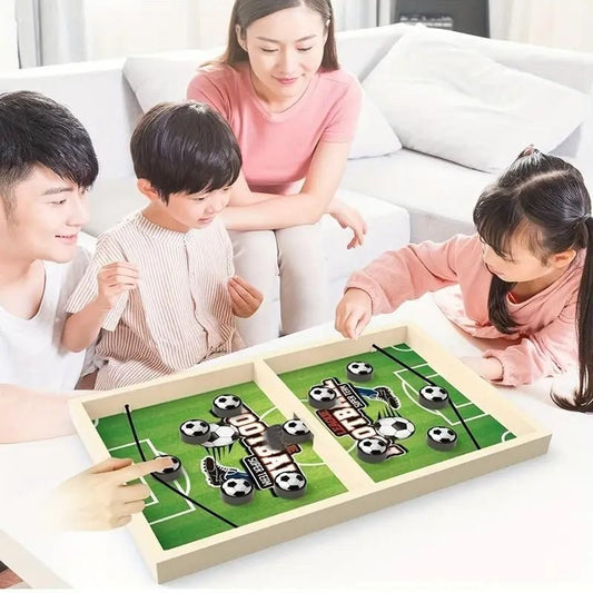Family playing catapult board game for kids featuring a soccer theme on a colorful board