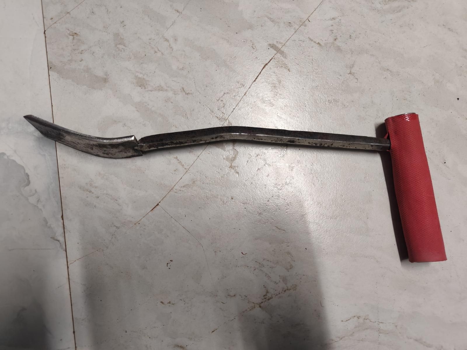 Metal compact shovel for planting and weeding with a red rubber handle for better grip
