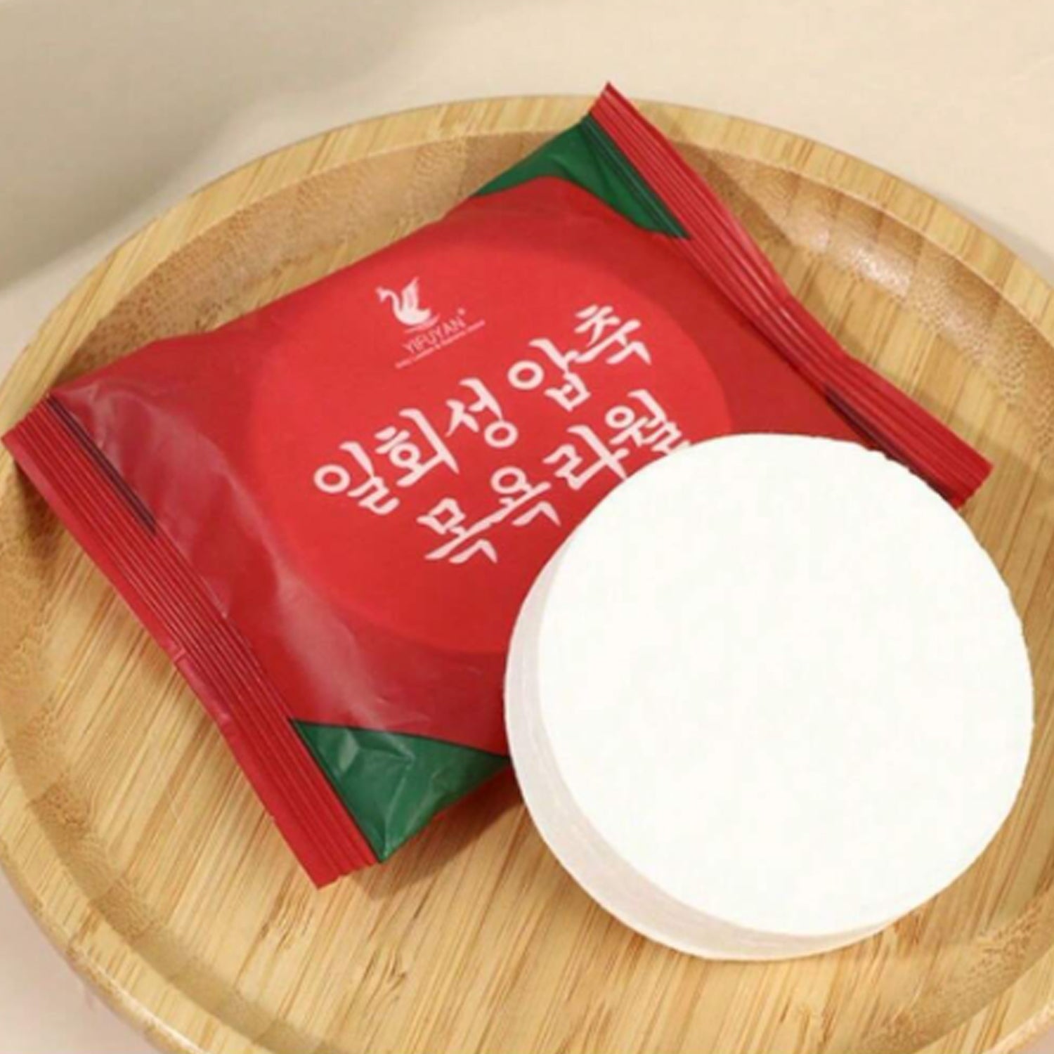 Compressed cotton towels for travel in eco-friendly packaging on a wooden plate