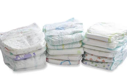 Stack of cotton soft diapers for infants in various designs and sizes, ideal for comfortable and gentle use
