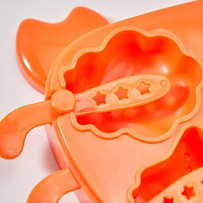 Crab ice mold for kids in orange, featuring star-shaped scoop for fun ice creations