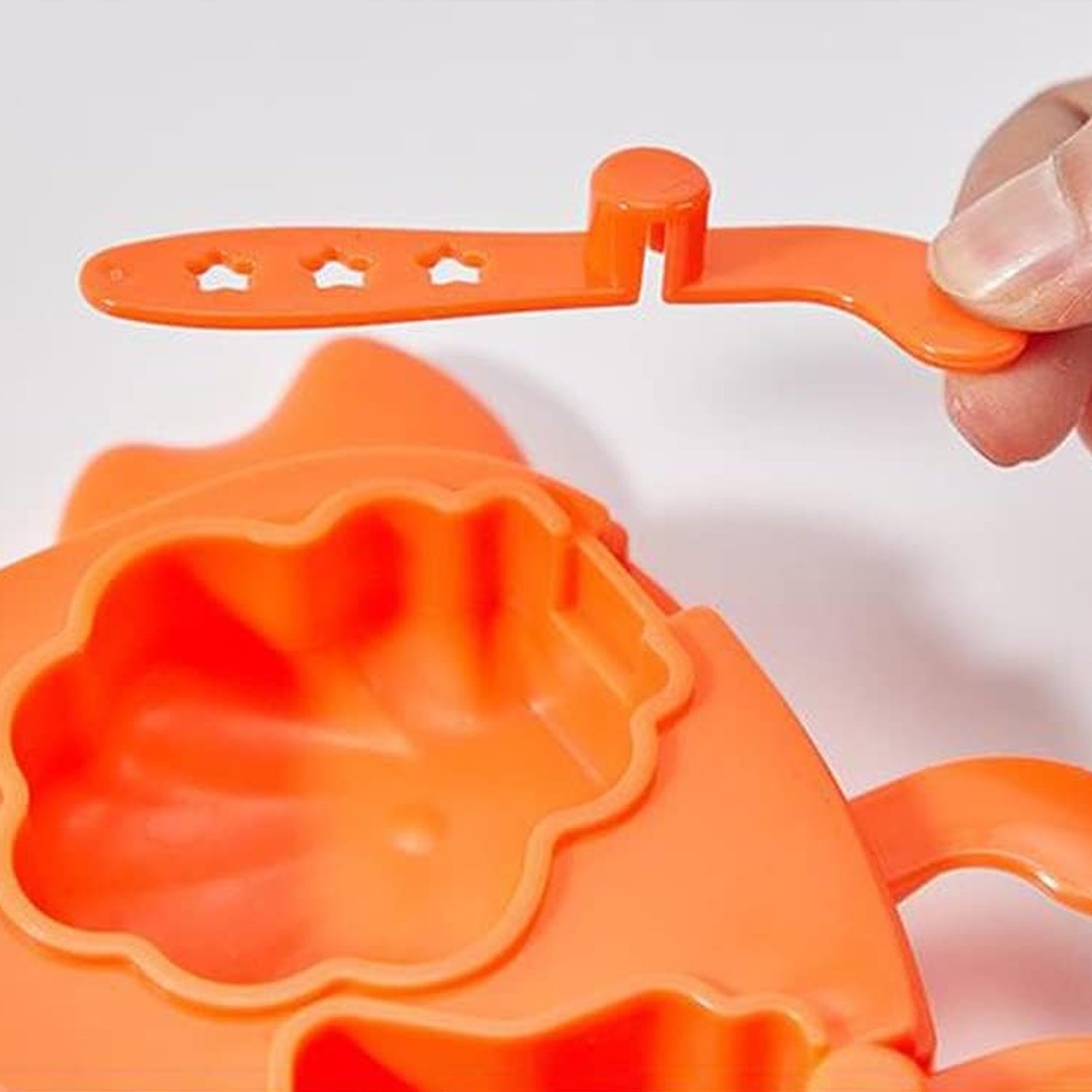 Bright orange crab ice mold for kids with a star-shaped scooper for fun ice shapes