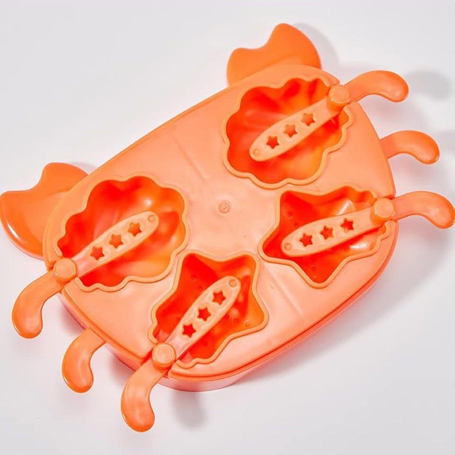 Crab ice mold for kids in orange with four fun shapes and easy-to-use levers