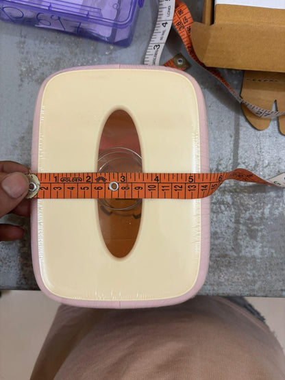 Creative square tissue box holder with an elegant design and measuring tape for size reference