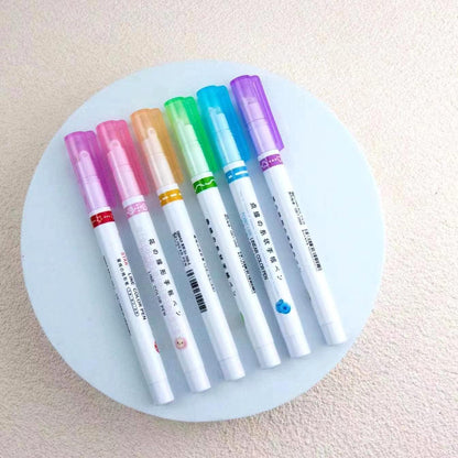 Set of six curve shape highlighter pens in assorted colors on a round display surface