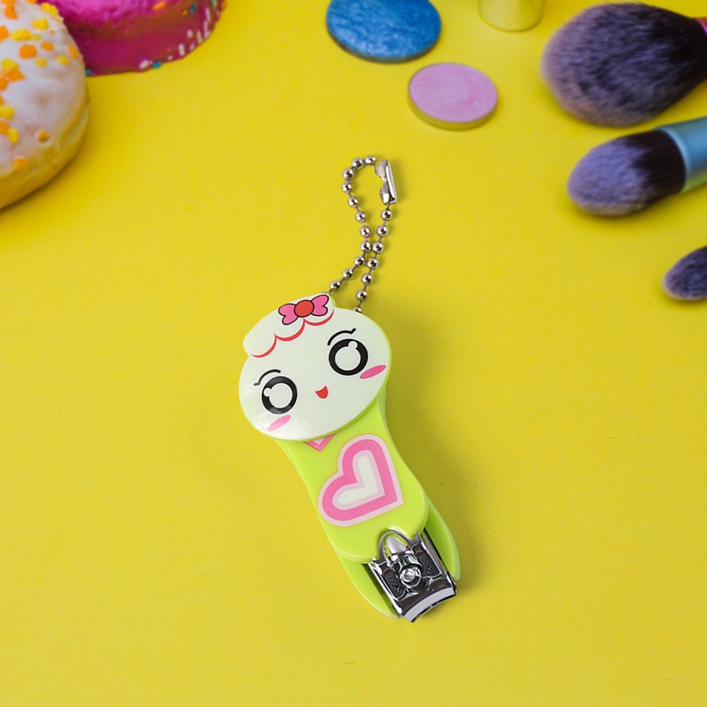 Cute cartoon nail clipper with a smiling face and heart design for fun and easy grooming