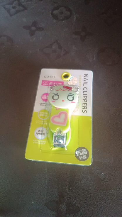 Cute cartoon nail clipper in green and pink packaging, ideal for fun and stylish grooming