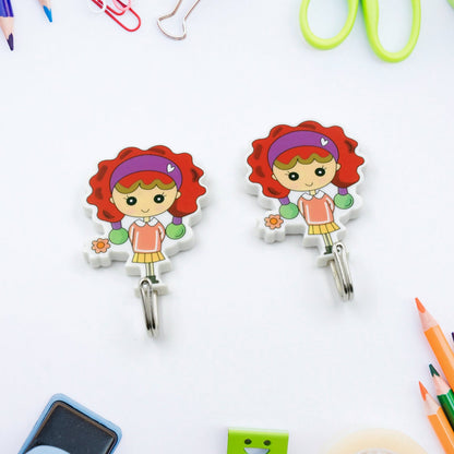 Cute cartoon wall hooks for kids featuring a girl with red hair and flowers for organizing rooms