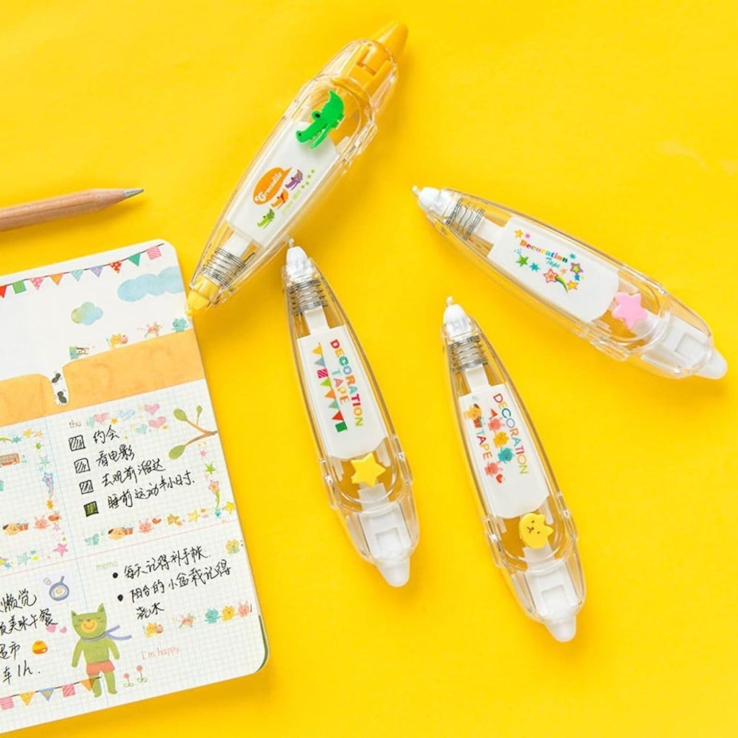 Set of four cute decoration tape pens in various designs on a bright yellow background