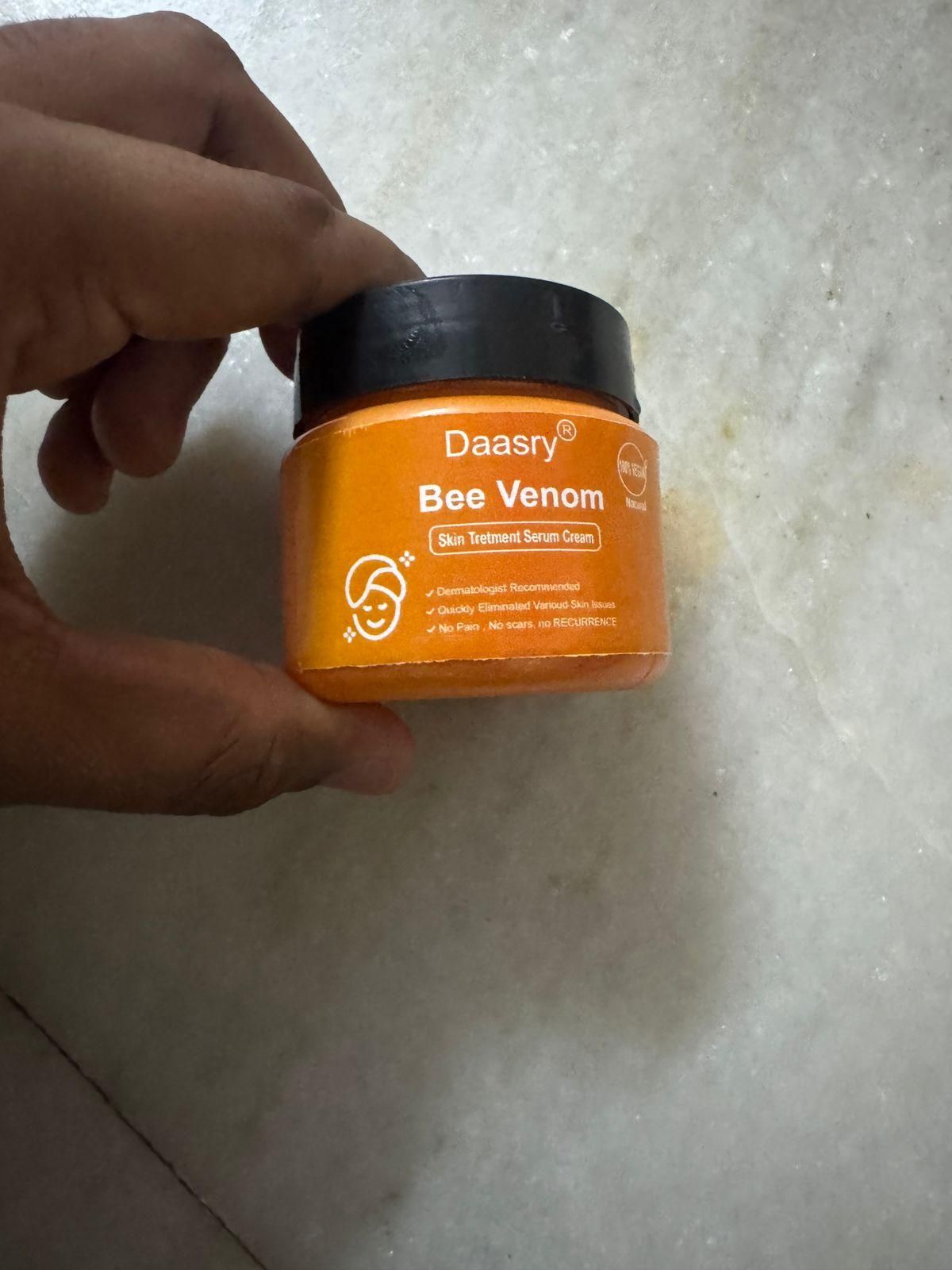 Daasry Bee Venom Skin Cream in an orange jar for skincare and rejuvenation