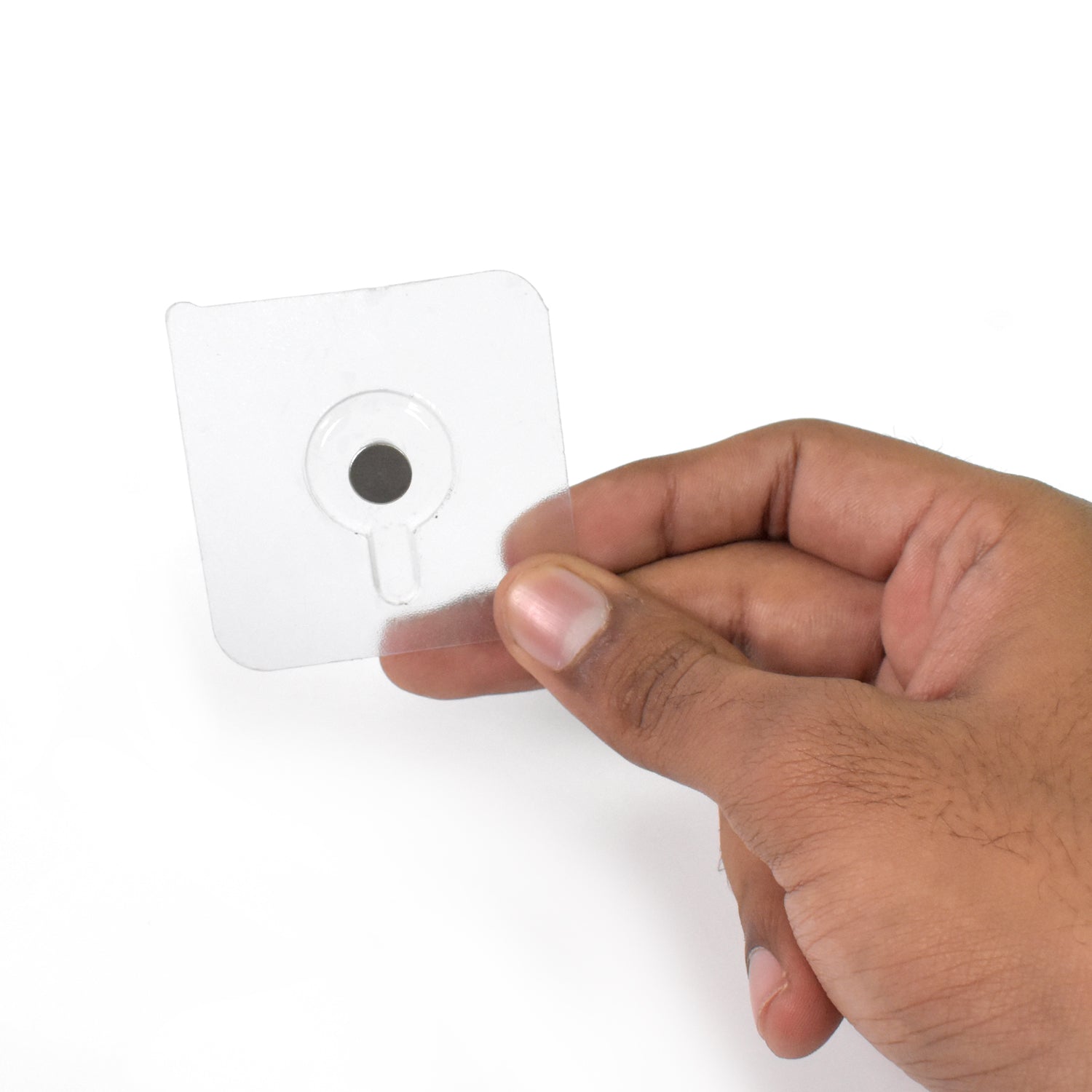 Clear adhesive damage-free wall hooks for photo frames held in hand, perfect for home decor
