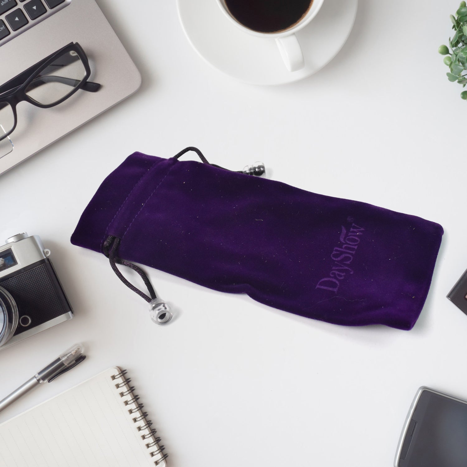 Small fancy return gift bags in elegant purple velvet with a drawstring closure