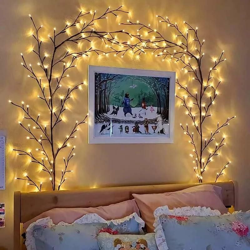 Decorative branch fairy lights arranged above a bed creating a cozy ambiance in a bedroom