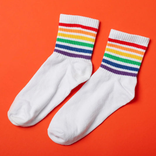 White designer socks for women featuring colorful rainbow stripes at the top