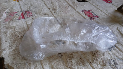 Clear disposable shower caps for women designed to protect hair during bathing