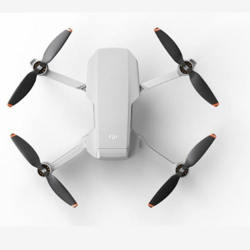 DJI Mini 2 SE Drone with four propellers in a sleek, compact design for aerial photography