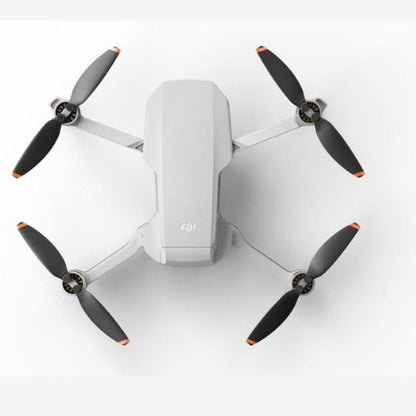 DJI Mini 2 SE Drone with four propellers in a sleek, compact design for aerial photography