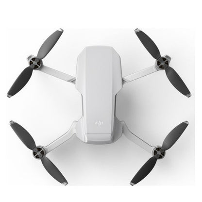 DJI Mini 2 SE drone combo in white with four propellers for aerial photography