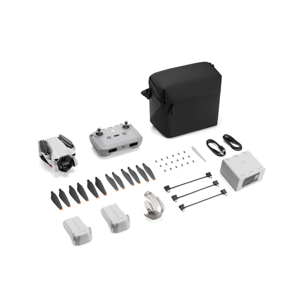 DJI Mini 3 Fly More Combo accessories including drone, controller, extra propellers, and carrying bag