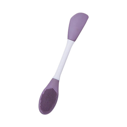 Double-headed silicone mask brush in purple and white for easy application of skincare masks