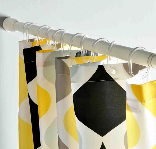 THE GIR FARMER drill-free adjustable curtain rod with colorful patterned curtains hanging on clear rings