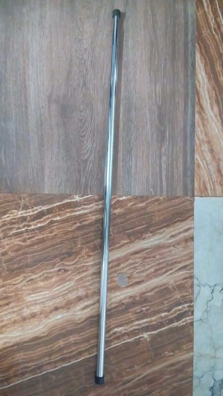 THE GIR FARMER drill-free adjustable curtain rod with silver finish on tiled floor background