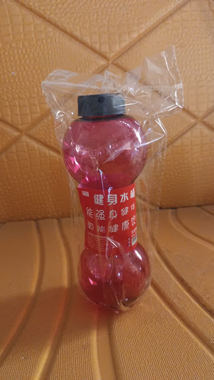 Dumbbell shape water bottle in pink, perfect for fitness enthusiasts and gym lovers