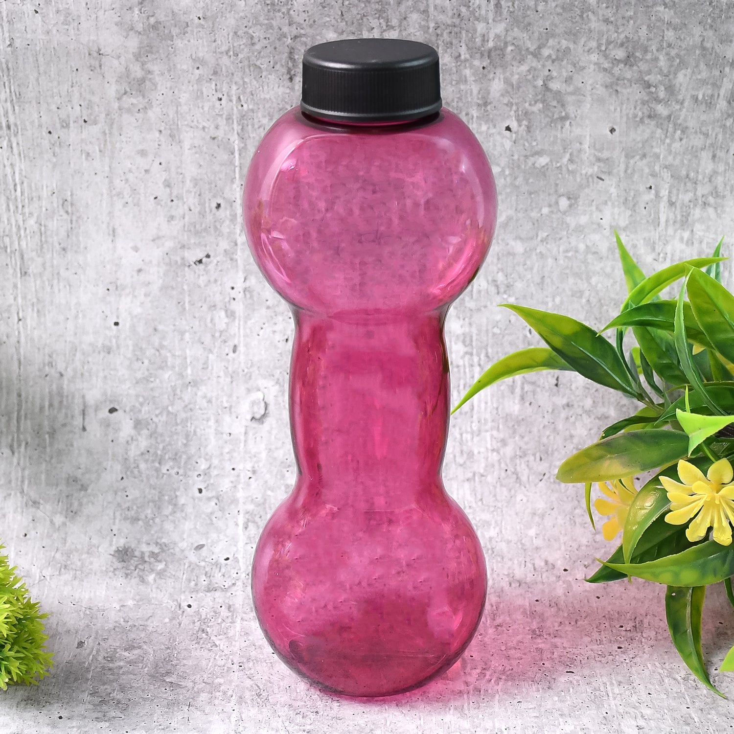 Dumbbell shape water bottle in vibrant pink color for fitness enthusiasts and hydration on the go