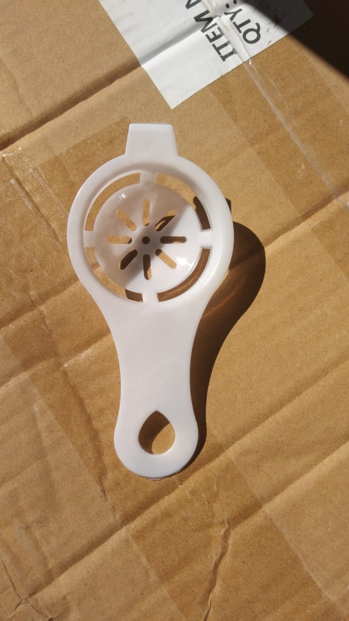 Your Brand egg yolk separator in white plastic with a comfortable grip for easy use in the kitchen