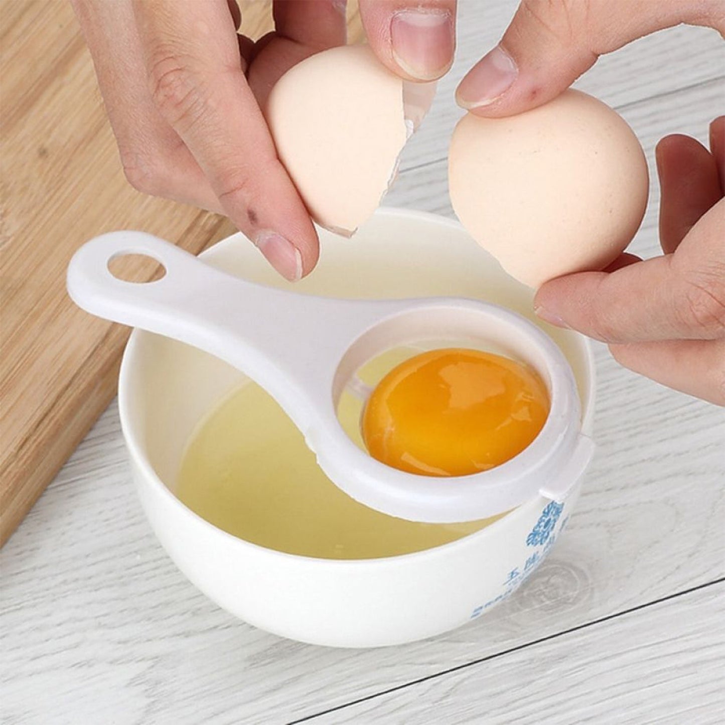 Your Brand egg yolk separator in use, separating yolk from whites for easy cooking